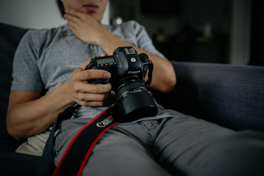 Woman documentary photographer with a camera around her neck